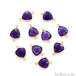 May include: Ten amethyst gemstone triangle connectors with gold-plated jump rings. The connectors are perfect for adding a touch of sparkle to jewelry projects.