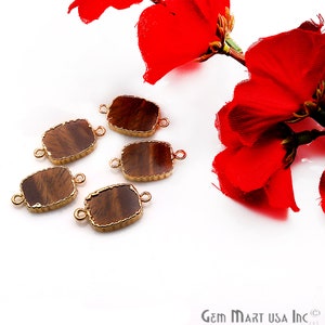 May include: Six gold-toned metal connector pieces with brown agate stone inserts. Each piece has two loops for attaching to jewelry.