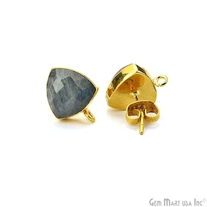 May include: A pair of gold-tone earring findings with a triangular blue gemstone. The findings have a post and a loop for attaching a dangle.