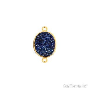 May include: Gold-toned oval pendant with a blue agate stone. The stone has a sparkly, speckled texture.
