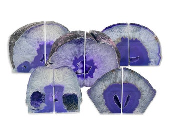 May include: Set of purple agate bookends. The bookends are made from natural agate and have a unique, natural pattern. They are perfect for adding a touch of nature to your home decor.