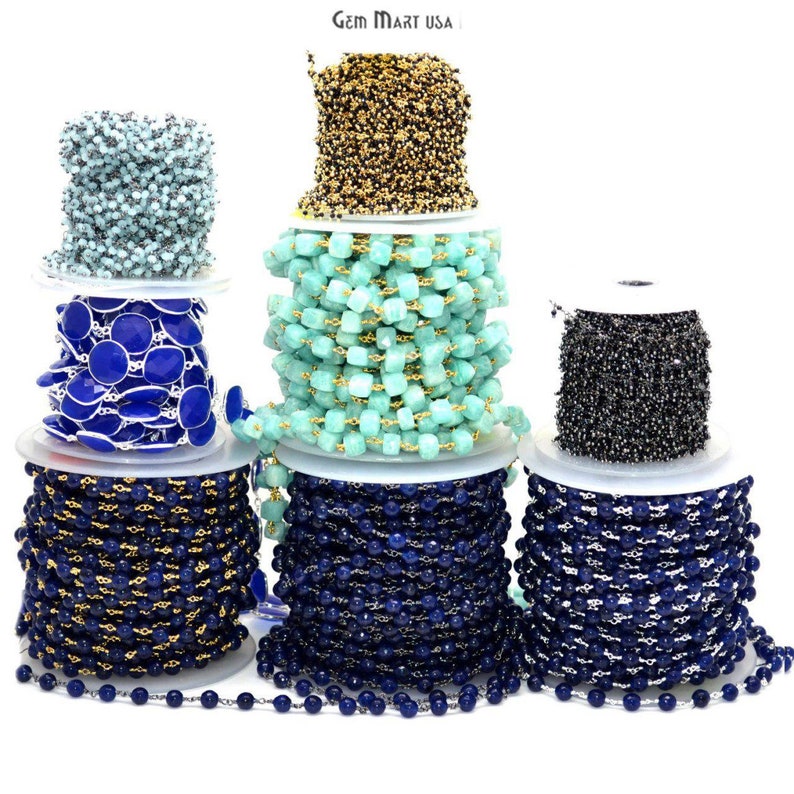 May include: Spools of various gemstone and metal chain, including blue, turquoise, and gold. Gem Mart USA is printed on the top of the image.