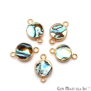May include: Five gold-toned round abalone shell connector charms with two jump rings each. The abalone shell has a natural iridescent blue, green, and brown pattern.