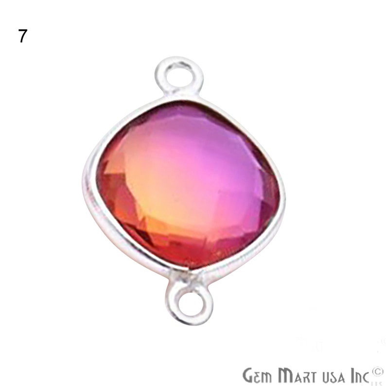 May include: A silver-toned pendant with a square-shaped, faceted, iridescent gemstone. The gemstone is a gradient of pink, orange, and red. The pendant has a loop at the top and bottom for attaching to a chain or cord.