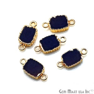 May include: Five gold-toned connector charms with black glass insets. Each charm has two loops for attaching to jewelry.