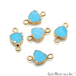 May include: Five turquoise blue gemstone connector charms with gold-toned metal accents. Each charm has two loops for attaching to jewelry.