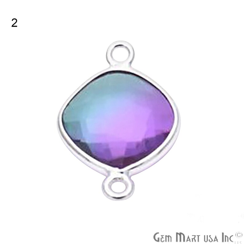 May include: A silver-toned pendant with a square-shaped iridescent gemstone. The gemstone has a gradient of colors, from green to purple. The pendant has a loop at the top for attaching to a chain or cord.