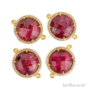 May include: Four gold-tone round pendant charms with a red gemstone center and a clear crystal halo. Each charm has two loops for attaching to a necklace or bracelet.