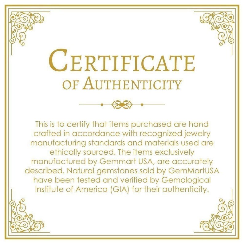 May include: A certificate of authenticity with a gold border and ornate design. The text reads "CERTIFICATE OF AUTHENTICITY". The certificate states that items purchased are hand-crafted in accordance with recognized jewelry manufacturing standards and materials used are ethically sourced. The items are exclusively manufactured by Gemmart USA and natural gemstones sold by GemMartUSA have been tested and verified by the Gemological Institute of America (GIA) for their authenticity.