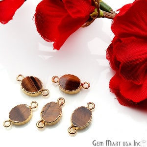 May include: Five gold-toned oval-shaped connector charms with tiger's eye stone inlays. Each charm has two loops for attaching to jewelry.