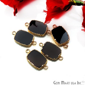May include: Five black rectangular glass connector charms with gold-toned metal frames and two loops on each side. The charms are on a white surface.
