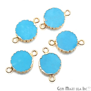May include: Five turquoise blue round connector charms with gold-toned metal settings and two jump rings. The charms are perfect for adding a pop of color to jewelry projects.