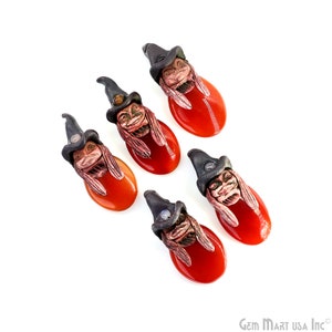 May include: Five witch pendant charms with red carnelian stones. Each charm features a detailed sculpted witch face with a black pointed hat and long hair.