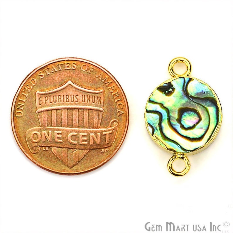 May include: Gold-tone connector with a round abalone shell inlay. The connector is about the size of a US penny.