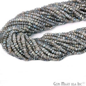 May include: A strand of gray faceted labradorite gemstone beads. The beads are small and have a shimmery, iridescent finish.