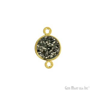 May include: Gold-tone connector with a round black and silver gemstone. The connector has two loops for attaching jewelry.