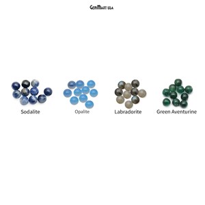 May include: Four groups of round, polished gemstones. From left to right: Sodalite, a deep blue color; Opalite, a light blue color; Labradorite, a gray color with hints of blue and green; Green Aventurine, a green color.