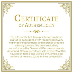 May include: A gold certificate of authenticity with a decorative border. The text reads "CERTIFICATE OF AUTHENTICITY". The certificate states that items purchased are hand-crafted in accordance with recognized jewelry manufacturing standards and materials used are ethically sourced. The items are exclusively manufactured by Gemmart USA and are accurately described. Natural gemstones sold by GemMartUSA have been tested and verified by the Gemological Institute of America (GIA) for their authenticity.