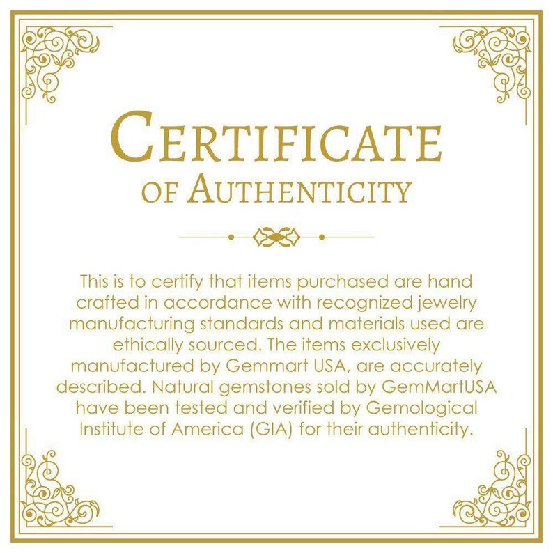 May include: A gold certificate of authenticity with a decorative border. The text reads "CERTIFICATE OF AUTHENTICITY". The certificate states that items purchased are hand-crafted in accordance with recognized jewelry manufacturing standards and materials used are ethically sourced. The items are exclusively manufactured by Gemmart USA and are accurately described. Natural gemstones sold by GemMartUSA have been tested and verified by the Gemological Institute of America (GIA) for their authenticity.