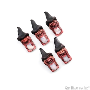 May include: Six small ceramic gnome figurines with black hats and red faces. Each gnome has a white iridescent stone in its chest area.