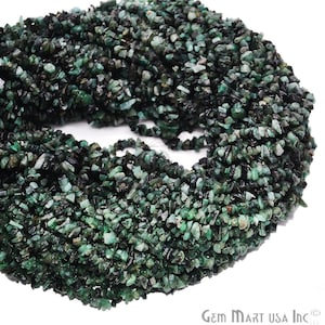 May include: A strand of emerald green chip beads. The beads are small and irregular in shape, with a rough, natural texture. The beads are strung together on a clear thread.