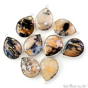 May include: Ten teardrop-shaped agate gemstone pendants with silver bail settings. The agate is a mix of brown, black, and white colours.