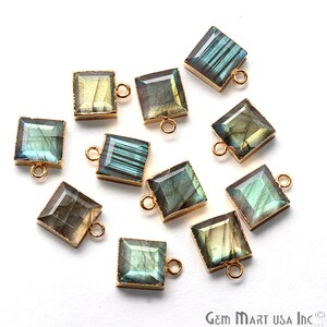 May include: Ten square-shaped labradorite gemstone pendants with gold-toned metal settings and jump rings. The pendants are approximately 1 inch in size.