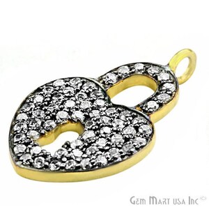 May include: A gold heart-shaped padlock charm with a keyhole, covered in small sparkling clear stones.
