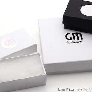May include: Three white gift boxes with a black and white logo that says "GemMart USA". The smallest box has white filling inside.