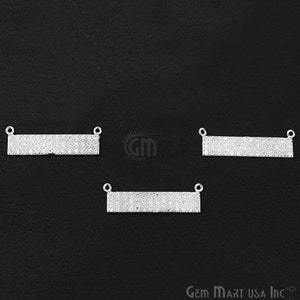 May include: Three silver-toned, rectangular, blank nameplate pendants with clear crystal embellishments. Each pendant has two small loops at the top for attaching a chain or cord.