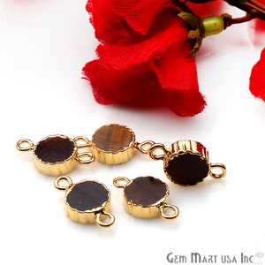 May include: Five gold-toned metal connector pieces with tiger's eye gemstone inserts. Each piece has two loops for attaching to jewelry.
