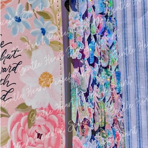 May include: A pink floral Bible cover with a matching tabbed edge. The tabs are decorated with flowers, glitter, and text labels. The cover features a large pink rose and the words "Gentle Heart Peaceful Spirit".