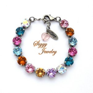 Pulsera de tenis arcoíris de cristal austriaco, cristales multicolores con dije de corazón, acabados surtidos.