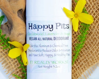 May include: A white deodorant stick with a label that reads "Happy Pits Cedarwood, Lavender & Sage Vegan All Natural Deodorant Use this Aluminum & Chemical Free Deodorant to Reduce Odor & Moisture and Have Soft, Happy, & Healthy Pits IT REALLY WORKS! Net Weight 3.2 oz."