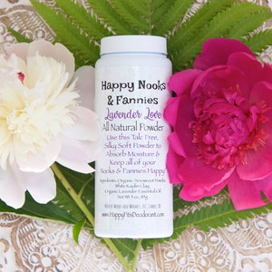 May include: White plastic bottle with a pink and white floral background. The bottle is labeled "Happy Nooks & Fannies Lavender Love All Natural Powder". The label also includes the text "Use this Talc Free, Silky Soft Powder to Absorb Moisture & Keep all of your Nooks & Fannies Happy".