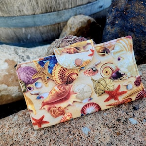 May include: A set of three ceramic mugs with a speckled, matte finish. The mugs are in shades of cream, light gray, and dark gray. Each mug has a simple, modern design and a rounded handle. Perfect for coffee or tea.