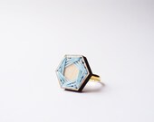 wooden laser cut geometric ring . pastel blue thread . hexagon . golden ring