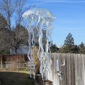 This amazing Jellyfish wind chime will be the center of attention where ever you hang it.