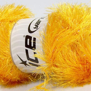 May include: A skein of yellow fuzzy yarn with a white label that says "Ice Yarns" on it.