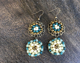 Beaded circle drop earrings in bronze, cream and green