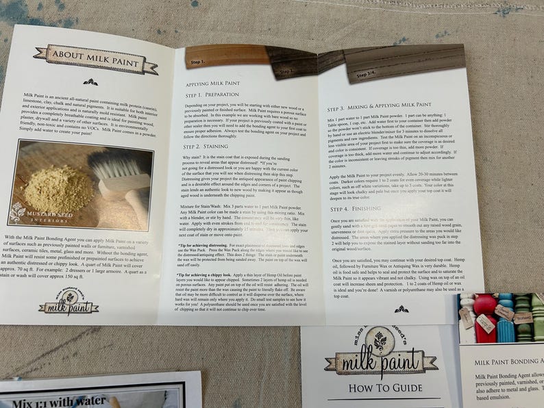 May include: A how-to guide for using milk paint, a natural, environmentally friendly paint. The guide includes instructions for preparing, staining, mixing, applying, and finishing milk paint. The guide also includes a close-up of a brush and a jar of milk paint powder.