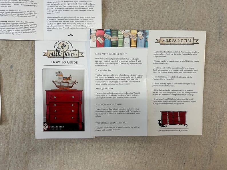 May include: A guide to using milk paint, with tips on bonding agents, waxes, and finishes. The guide includes images of a red painted dresser and a rocking horse.