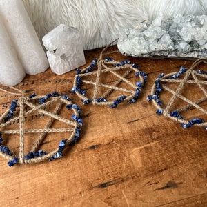 May include: Three handmade pentagram dreamcatchers with blue lapis lazuli stones and brown twine.