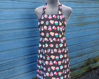 Apron, full length, Amy Lynn Aprons, bib style, black with whimsical cupcake pattern, adult size