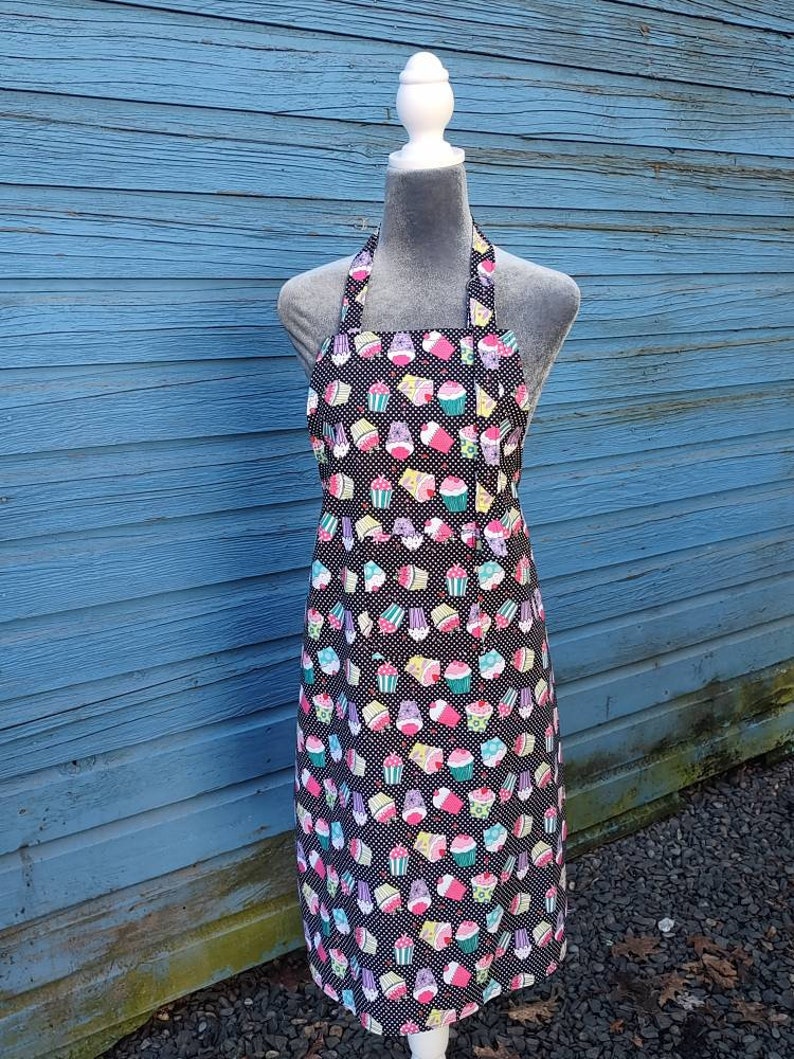 Apron, full length, Amy Lynn Aprons, bib style, black with whimsical cupcake pattern, adult size image 1