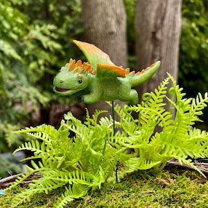 May include: A rustic wooden sign with the text "Welcome to our home" in white lettering. The sign features a distressed finish and a simple, inviting design, perfect for a front porch or entryway.