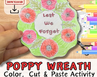 May include: A poppy wreath craft activity with the text "Lest We Forget" in the center. The wreath is surrounded by red poppies and green leaves. The words "POPPY WREATH Color, Cut & Paste Activity" are at the bottom.