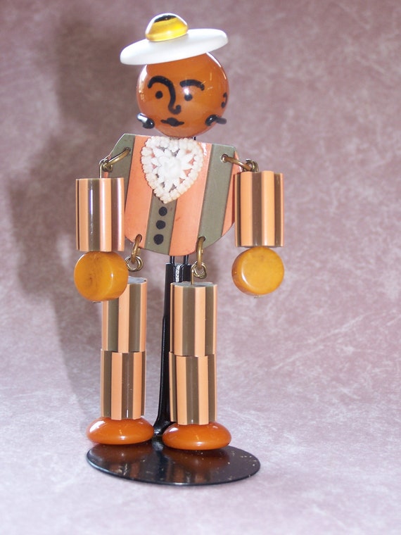 Adorable  Crib Toy Style Bakelite Man