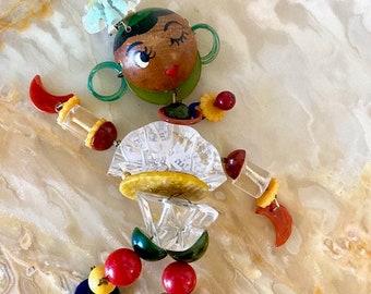 Large Winking Girl Jan Carlin Figural Cribtoy Style Brooch utilizing vintage Lucite, Wood and Bakelite methods and materials