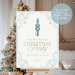 May include: A Christmas party sign featuring a nutcracker illustration in blue and gold. The sign reads "Welcome to the Annual Christmas Party" with the date December 22, 2025, and the city Toronto. Includes menus, name cards & more!